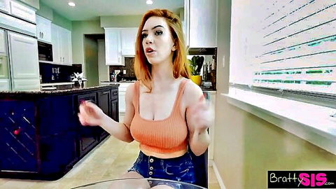 Redhead in orange tank top and shorts teases with surprised boner reaction