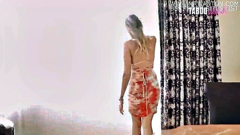 Nikki Brooks blonde MILF in sexy red backless dress, looking back seductively