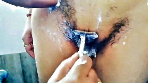 Hairy Indian girlfriend's pussy shaved by hand, explicit close-up