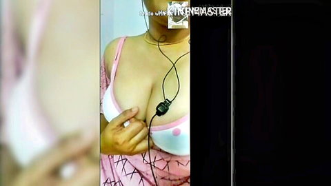 Busty South Asian babe in pink polka dot bra showing massive cleavage and big tits