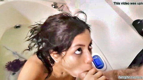Canela Skin wet in tub, mouth near blue toy after anal fetish fuck