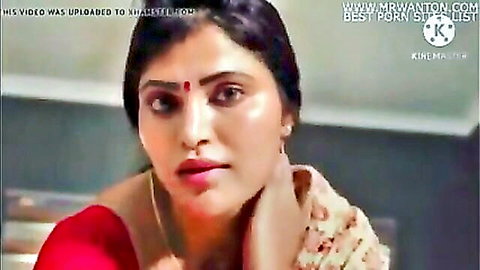 Seductive Indian woman in red saree with bindi and pouty lips craving cock