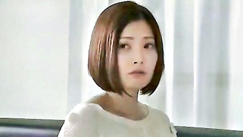 Asian woman with short brown bob hair in white top, seductive wife scene from JAV porn