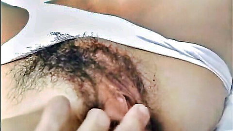 Man's fingers fingering hairy wet pussy with white swimsuit pulled aside