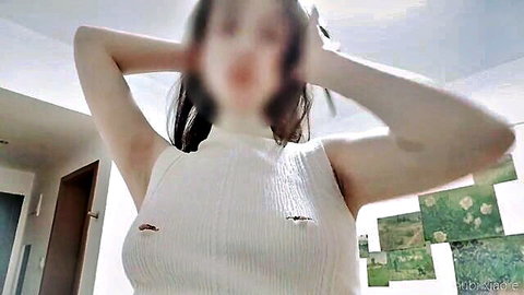 Asian woman in tight white tank top with visible nipples, arms raised teasing