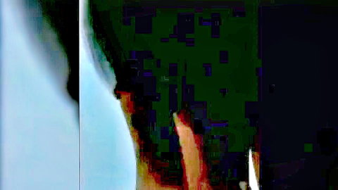 Blurry side view of dark-haired dude in explicit adult scene with two dicks