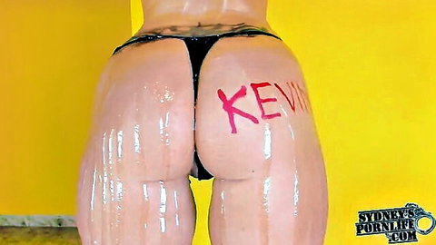Oiled up big ass with 'Kevin' written on cheek in thong, fan tribute
