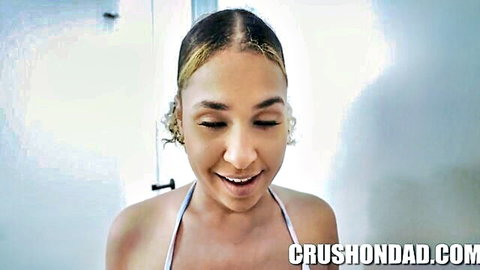 Ryder Rey smiling seductively in strapless top, petite beauty