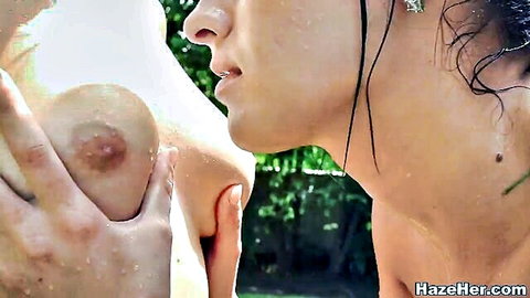 Two wet college girls fondling breasts outdoors in steamy lesbian scene