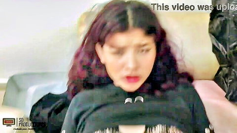 Purple-haired Asian woman in sexy black crop top, aroused expression