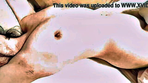Nude solo female with nipple piercing, pale skin, erotic lying pose