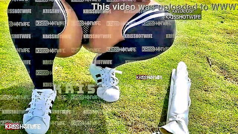 Hotwife Krissy squats on grass spreading huge bare ass cheeks outdoors in stockings and Adidas sneakers