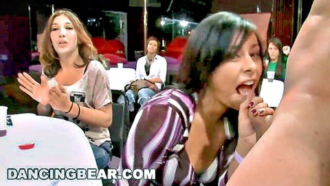 Brunette with wide open mouth near massive erect cock as friends clap excitedly at CFNM party