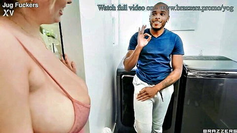 Busty white MILF squeezing huge tits in pink top with black stud in laundry room
