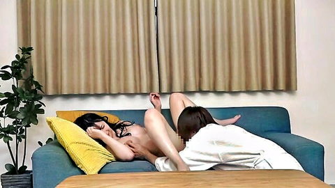 Japanese babe naked on sofa spreads legs as lover in robe eats her pussy