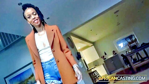 East-African beauty in orange blazer and denim shorts for African Casting
