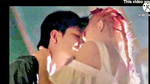 Passionate kiss in idol debut scene, Asian couple embracing intimately