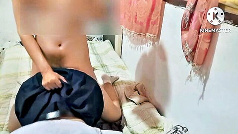 Amateur nude woman on bed pulls down man's blue shorts exposing shaved pussy and his cock in missionary position