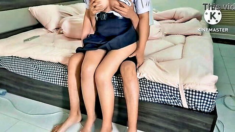 Young Thai schoolgirl exposes bare perky tits sitting on boyfriend's lap in school uniform homemade amateur
