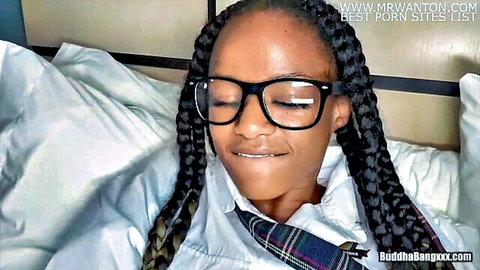Raven Swallows as black college slut in glasses and schoolgirl outfit, teasing smile