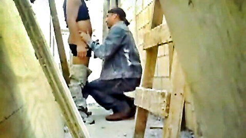 Kneeling Arab man eats bare ass of muscular guy bent over in outdoor construction site gay rimjob.