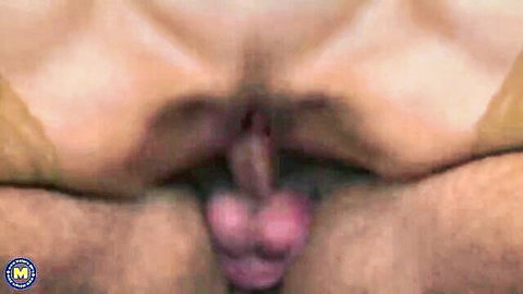 Closeup of mature granny's wet pink pussy lips spread wide exposing swollen clit