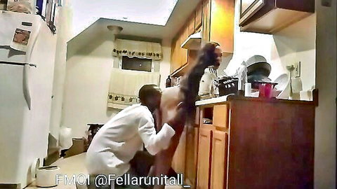 Ebony man in white shirt fucking curvy black woman doggy style from behind