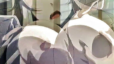 Two busty Asian women in sheer tops exposing massive breasts