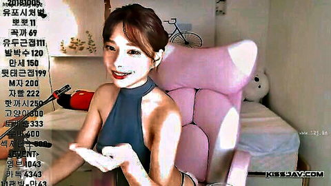 Korean girl with big tits in gray halter top, smiling seductively
