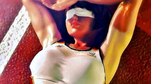 Blindfolded athletic Asian babe Rena Senpai in tight sports uniform, seductive pose