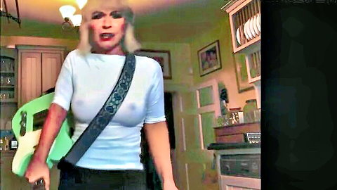 Toyah Wilcox braless in sheer white top, blonde rockstar look with guitar