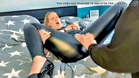 Milena Sweet in shiny latex dominates slave, legs spread in ecstasy