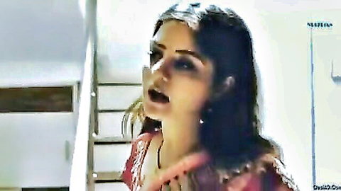 South Asian mature woman in red saree moaning intensely with open mouth and wide eyes