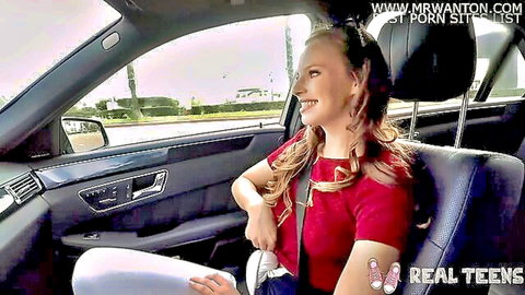 Jillian Janson smiling in car seat, red top and white bottoms, amateur teen tease