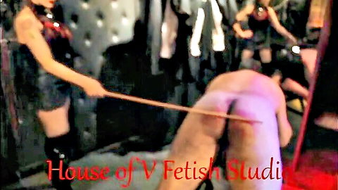 Goddess V in latex dominates naked Floyd with cold caning in femdom BDSM scene