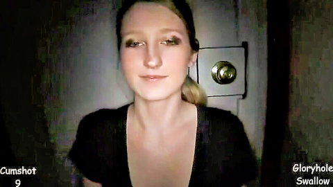 Blonde ponytail babe smiles with deep cleavage at glory hole door for cumshot swallow
