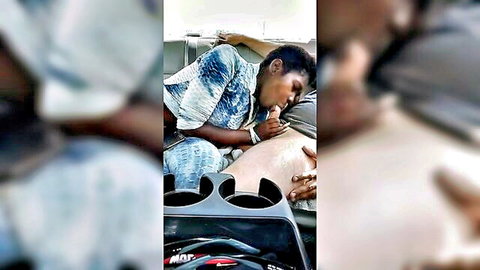 Ebony beauty seducing white man with oral in car interior
