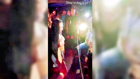 Venezuelan Latina stripping topless in crowded discotheque club