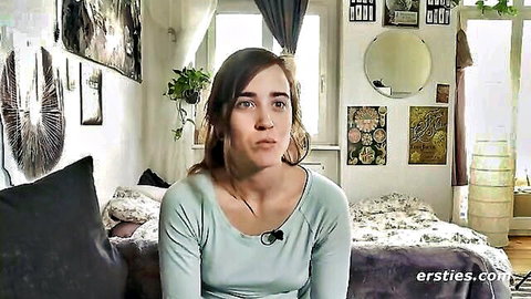 Effie, amateur model in green top, solo bedroom scene from Ersties