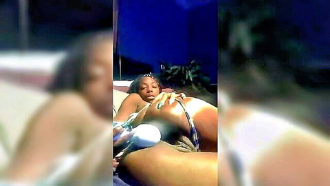 Ebony woman masturbates with large dildo in white lingerie