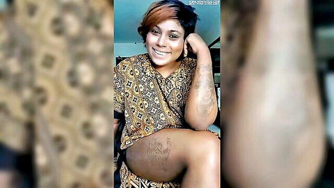 Tattooed curvy Indian MILF in batik top smiling teasingly