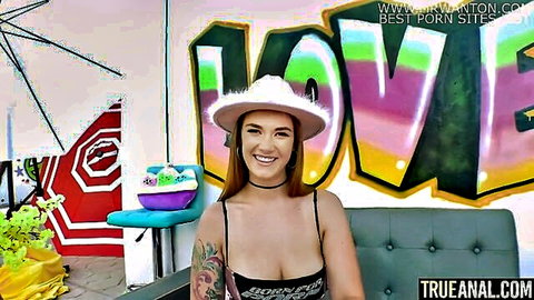 Siri big booty in cowboy hat smiling with deep cleavage