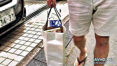 Japanese man in shorts carrying JAV DVD bag on street, Ferame studio tease