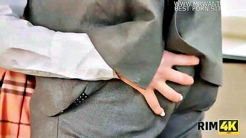Man grips petite wife's tight ass from behind under plaid skirt in hot couple foreplay
