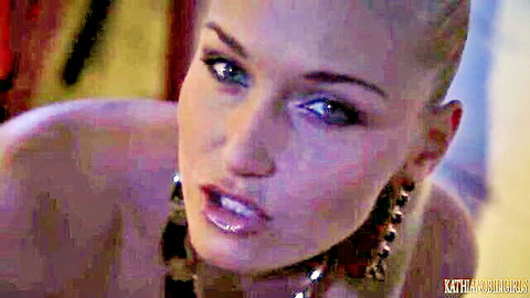 Bald headed beauty with glossy plump lips parted wide in seductive closeup tease