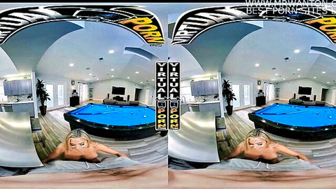 Blonde MILF with huge tits and big ass lies nude on floor by pool table, looking back in VR POV