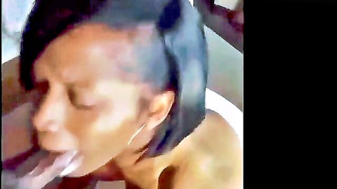 Ebony woman with short hair in close-up blowjob cumshot scene