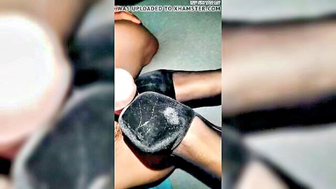 Nylon foot in black high heel pump covered in thick cum after footjob