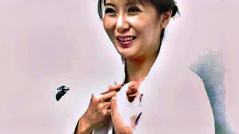 Smiling Japanese woman in white fur coat teases in naughty JAV scene