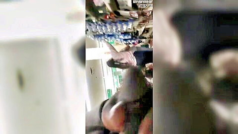 Blurry POV hand filming supermarket aisle shelves with detergents for flashing tease